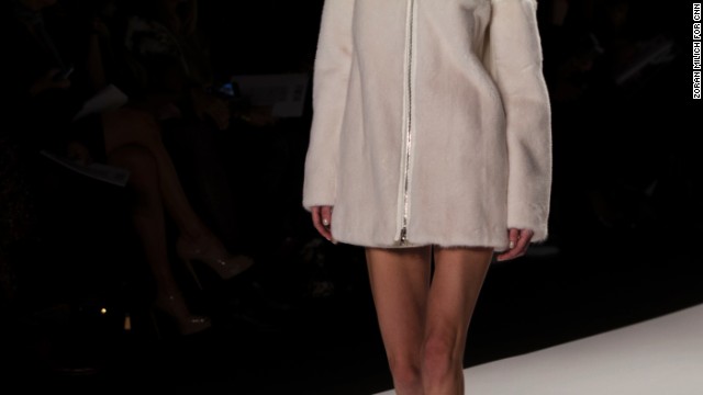 A bare-legged model rocked a cozy coat down the runway.