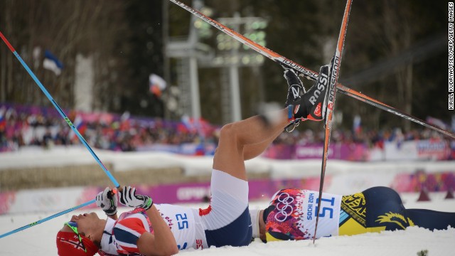 Norwegian cross-country skier Chris Andre Jespersen lies on the snow after crossing the finish line in the men's 15-kilometer classic on February 14.
