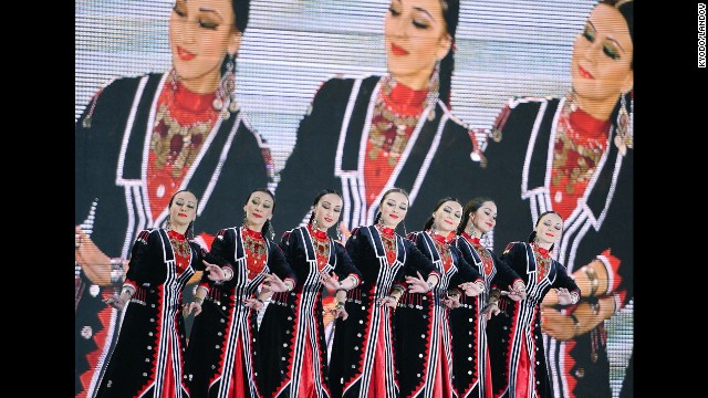 A traditional Russian dance is performed on stage during a medal ceremony February 12. 