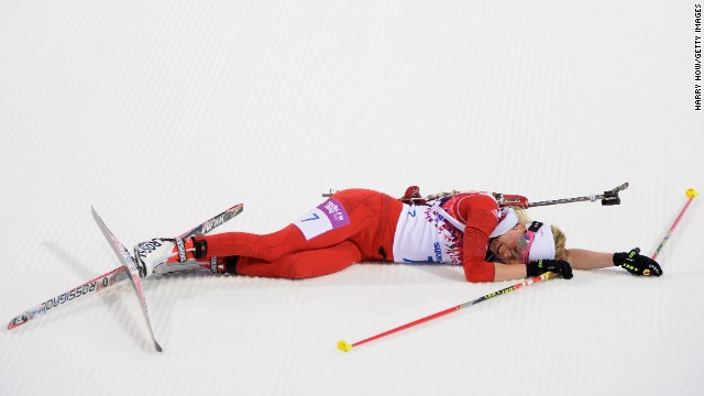 Cross-country skier Elisa Gasparin of Switzerland collapses at the finish line of the women's 15-kilometer race on February 14.