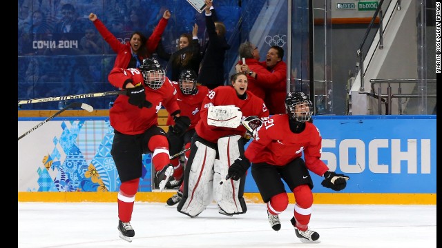 Switzerland celebrates winning 2-0 against Russia in the women's ice hockey quarterfinals.