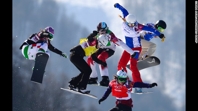 Athletes race in the final of the women's snowboard cross on February 16. 