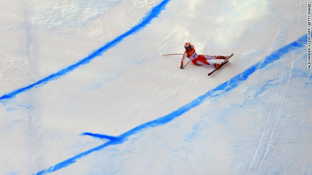 Canada's Erik Guay falls during the men's super-G.