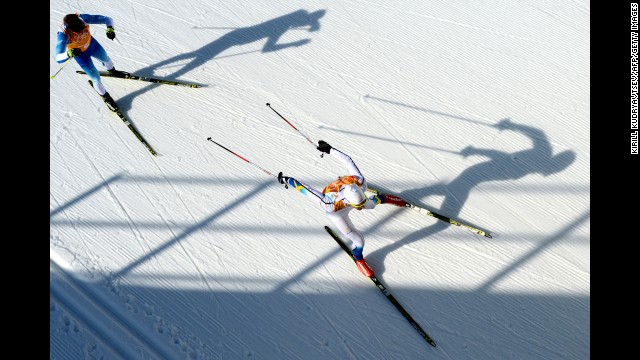 Finland's Lari Lehtonen and Sweden's Johan Olsson compete in the men's cross-country relay on February 16.