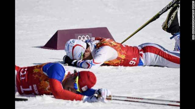 The Czech Republic's Ales Razym, left, and France's Jean Marc Gaillard rest after competing in the first group of the men's cross-country relay on February 16.