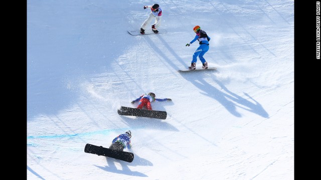 Snowboarders fall during the quarterfinals of women's snowboard cross on Sunday, February 16. 