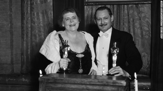 Marie Dressler and Lionel Barrymore collect their best actress and best actor Oscars in 1931. Dressler won for "Min and Bill" and Barrymore won for "A Free Soul."