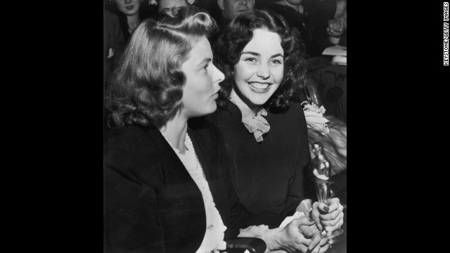 Jennifer Jones holds the best actress Oscar she won in 1944 for her performance in "Song of Bernadette." To her right is actress Ingrid Bergman.