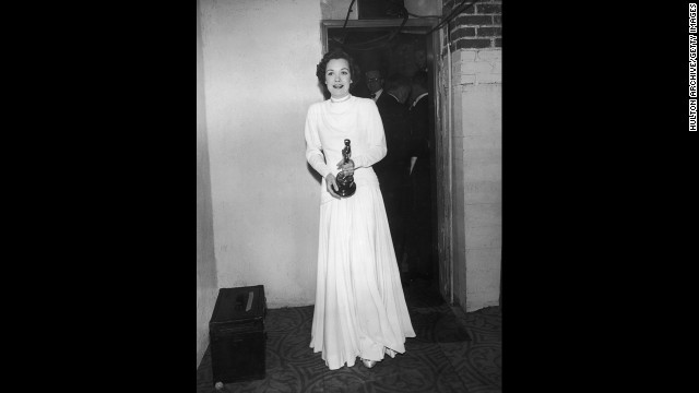 Jane Wyman stands by a doorway backstage at the Academy Awards. She won her best actress Oscar for the film "Johnny Belinda."