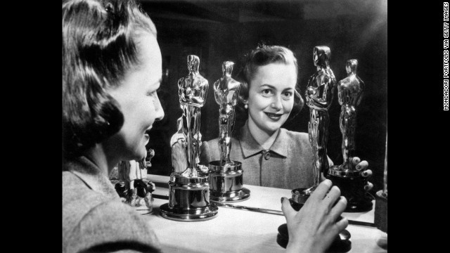 Olivia de Havilland looks at her two best actress Oscars. She won her second in 1950 for her role in "The Heiress."