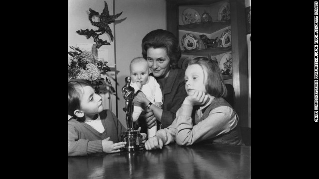 Patricia Neal and her three children look at her Oscar statuette, which she won in 1964 for her role in "Hud." 