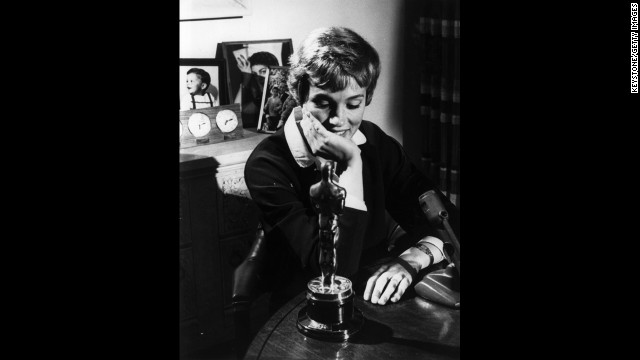 Julie Andrews looks at the Academy Award she won for "Mary Poppins'" in 1965. The role was her film debut. 