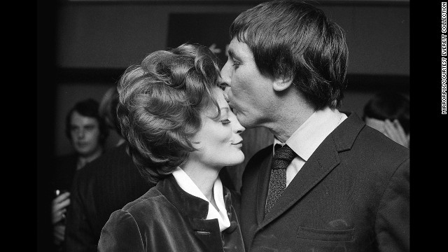 Maggie Smith, who won for "The Prime of Miss Jean Brodie," celebrates with her husband at the time, Robert Stephens.