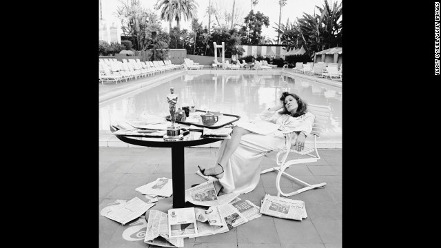 Faye Dunaway rests by the Beverly Hills Hotel swimming pool the morning after she received the best actress Oscar for "Network."