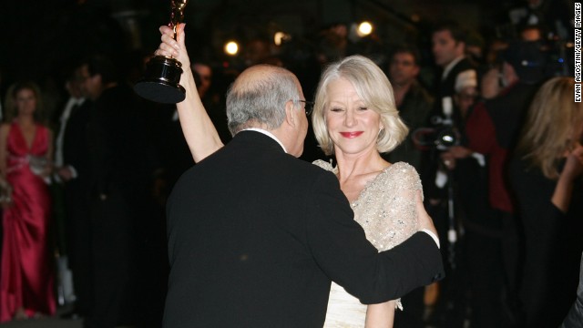 Director Taylor Hackford kisses his wife, Helen Mirren, after Mirren won the best actress Oscar for her role in "The Queen."