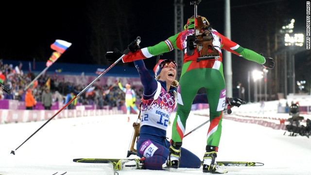 Gold medalist Darya Domracheva, right, of Belarus celebrates with bronze medalist Tiril Eckhoff of Norway after the women's 12.5-kilometer mass start event on February 17.