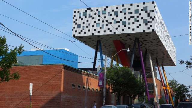 At Toronto's OCAD University, the Sharp Centre for Design is perched 26 meters above the ground on 12 stilts representing giant pencils. Five legs out of the six multi-colored pairs are painted black to give an illusion of slenderness, especially at night when the black legs seem to disappear. <strong>Architects:</strong> Alsop Architects, Robbie/Young + Wright Architects.