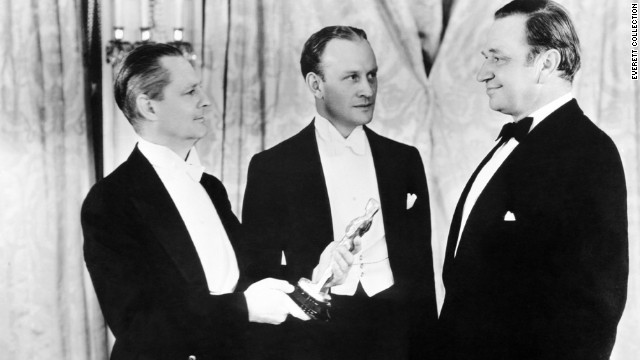 The previous year's Oscar winner Lionel Barrymore, left, presents Wallace Beery, right, with the best actor Oscar for "The Champ." Beery tied that year with Fredric March in "Dr. Jekyll and Mr. Hyde." 