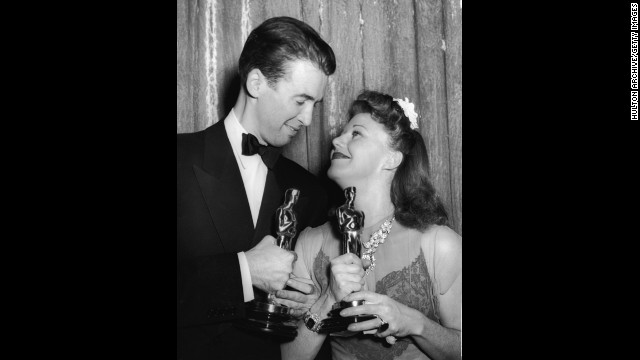 After losing the Oscar a year earlier for his iconic role in "Mr. Smith Goes to Washington," James Stewart received the award playing a reporter who falls for Katharine Hepburn in "The Philadelphia Story." Stewart and best actress winner Ginger Rogers celebrate their wins at the ceremony held in 1941.