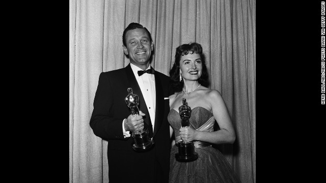 William Holden celebrates his best actor win for "Stalag 17" with best supporting actress winner Donna Reed at the Oscar ceremony in 1954. It was the actor's second nomination; his first was for Billy Wilder's 1950 classic "Sunset Boulevard."