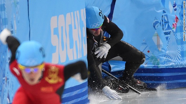 American Eduardo Alvarez loses his balance and crashes into the wall February 18 during a 500-meter short track speedskating race.