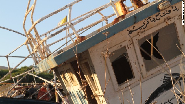 Abandoned boats fill a ship graveyard off the harbor.