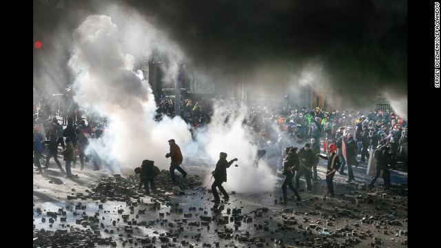 Protesters fight with riot police during a new wave of violent clashes Tuesday, February 18, in Kiev, Ukraine. Thousands of anti-government demonstrators have packed the capital's Independence Square since November, when President Viktor Yanukovych reversed a decision to sign a trade deal with the European Union and instead turned toward Russia.