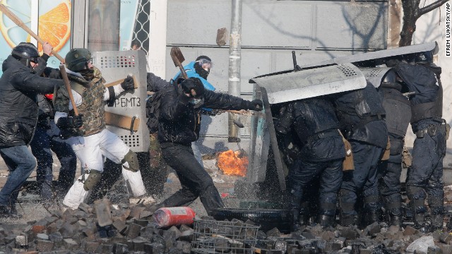 Protesters clash with riot police outside Ukraine's parliament in Kiev on February 18.