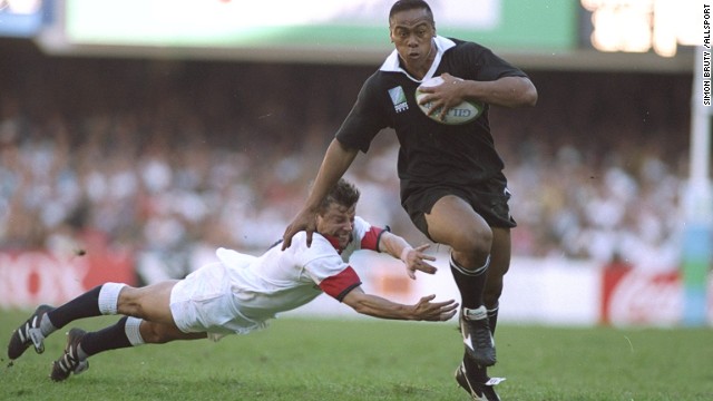 Lomu burst onto the scene at the 1995 World Cup, scoring four tries against England in the semifinals. Here, a desperate Rob Andrew fails in a last-ditch attempt to tackle the big man. 