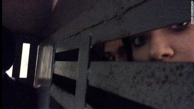 This photo provided by Alyokhina, was taken in the back of a police detention vehicle after her arrest on February 18. She and other band members tweeted the news about their detention from their cell phones, with Tolokonnikova posting photos of what she said was the vehicle that was taking her to a police station.