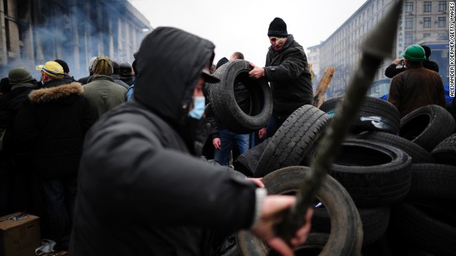 Protesters prepare a barricade in Independence Square on February 19.
