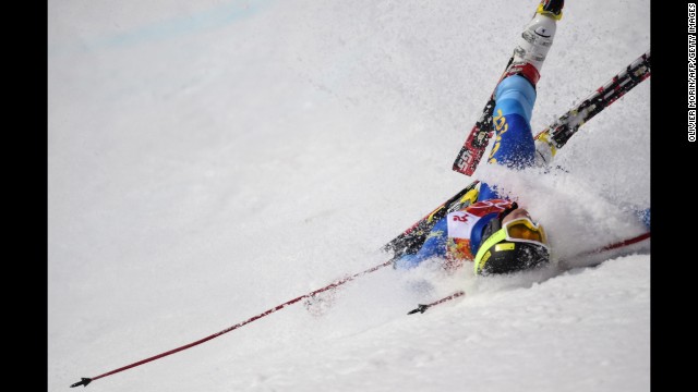 Dow Travers of the Cayman Islands crashes during the men's giant slalom on February 19.