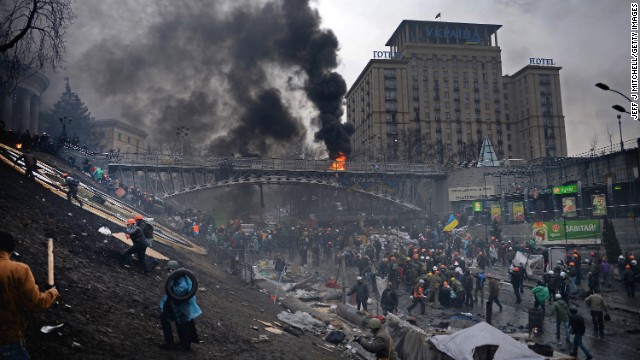 Protesters move up an embankment in Kiev on February 20.