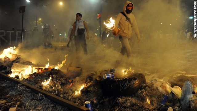 Protesters light fires during an anti-government demonstration in Caracas on Wednesday, February 19.