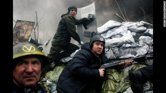 Protesters man a barricade on the outskirts of Independence Square on February 20.