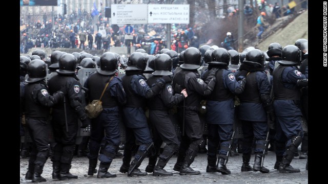 Riot police face protesters in Kiev on February 20.