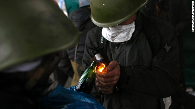 Protesters light Molotov cocktails in Kiev on February 20.