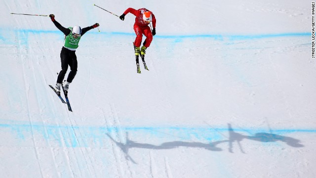 Jouni Pellinen of Finland, left, leads Armin Niederer of Switzerland during the men's ski cross.