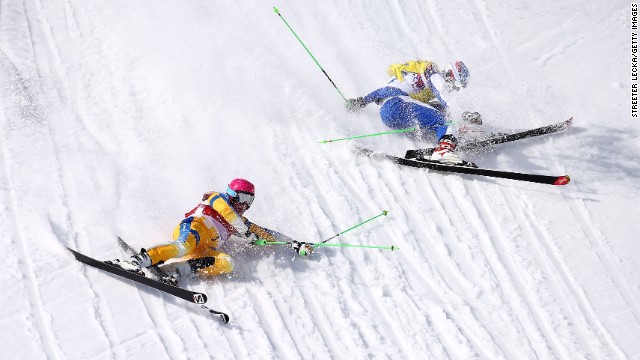 Victor Oehling Norberg of Sweden, left, and Egor Korotkov of Russia crash during the quarterfinals of the men's ski cross on February 20. 