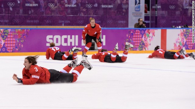 The Swiss women's hockey team celebrates after winning the bronze-medal game against Sweden on February 20.