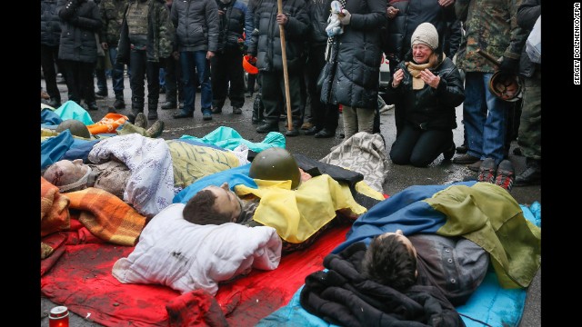 A woman on February 20 mourns over protesters who were killed during clashes.
