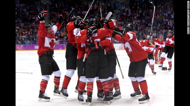 The women's hockey team from Canada celebrates Thursday, February 20, after Marie-Philip Poulin scored the game-winning goal in overtime to defeat the United States and win the gold medal.