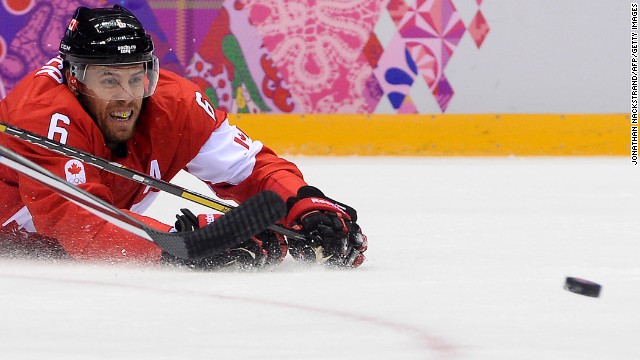 Canada's Shea Weber grimaces as he falls down during the hockey semifinal against the United States on Friday, February 21.