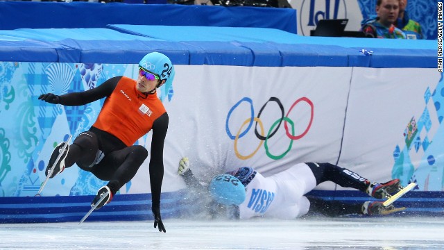 Vladimir Grigorev of Russia, right, hits the wall while Freek van der Wart of the Netherlands falls in a 500-meter short track race February 21.