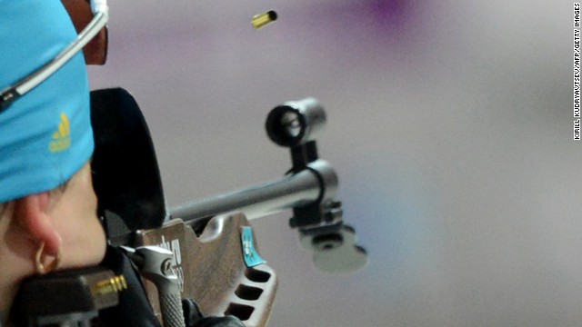 Ukrainian biathlete Olena Pidhrushna fires her rifle on her way to winning the gold medal in the team relay.