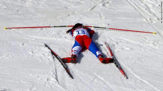 Eva Vrabcova-Nyvltova of the Czech Republic collapses on February 22 after the women's 30-kilometer mass start free cross-country event.
