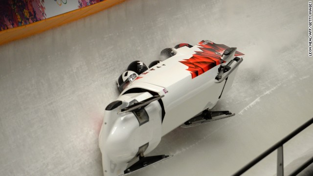 Canada's four-man bobsleigh team, made up of pilot Justin Kripps, pushman Jesse Lumsden, pushman Cody Sorensen and brakeman Ben Coakwell, crashes during a heat Saturday, February 22. 