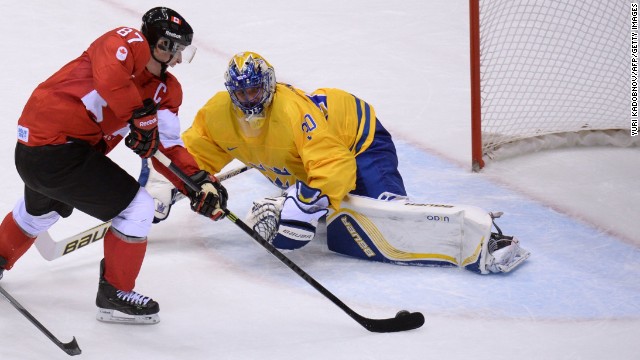 The Canadians also won the men's ice hockey title. Here Sidney Crosby scores past Sweden's goalkeeper Henrik Lundqvist during the final at the Bolshoy Ice Dome.