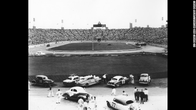 Cars prepare to race at Soldier Field. The stadium, on Chicago's South Side, first opened in 1924 and is still the home of the Chicago Bears today.