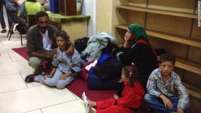 A Syrian family arrives at the mosque in Catania, Italy, on nearby Sicily.